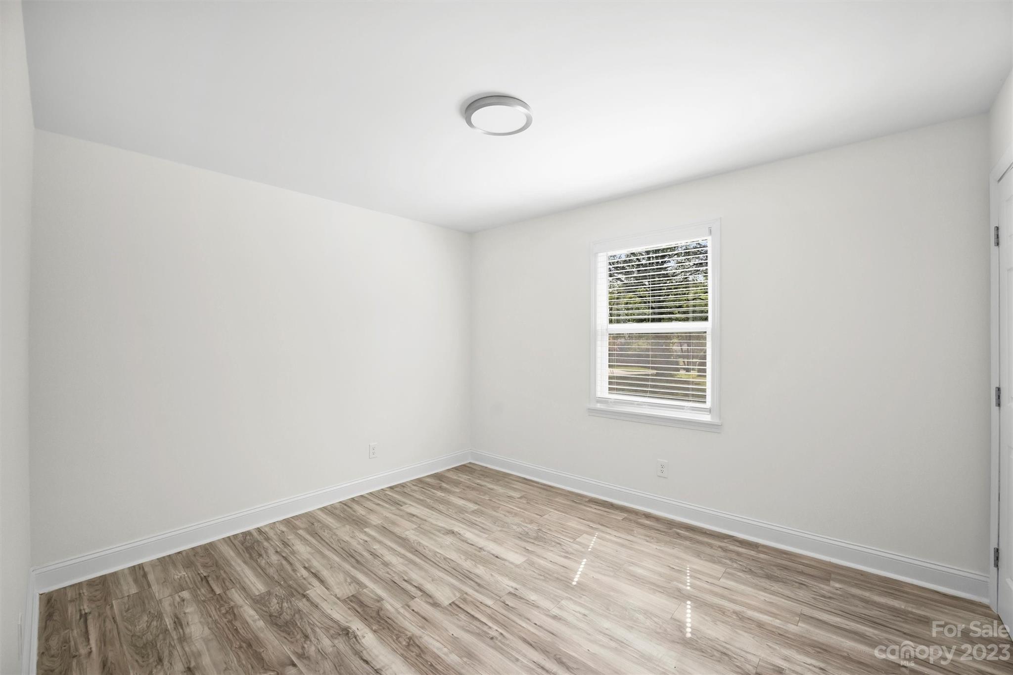 3900 Rhodes Avenue Charlotte, NC 28210 - Photo 12 of 23 an empty room with a window