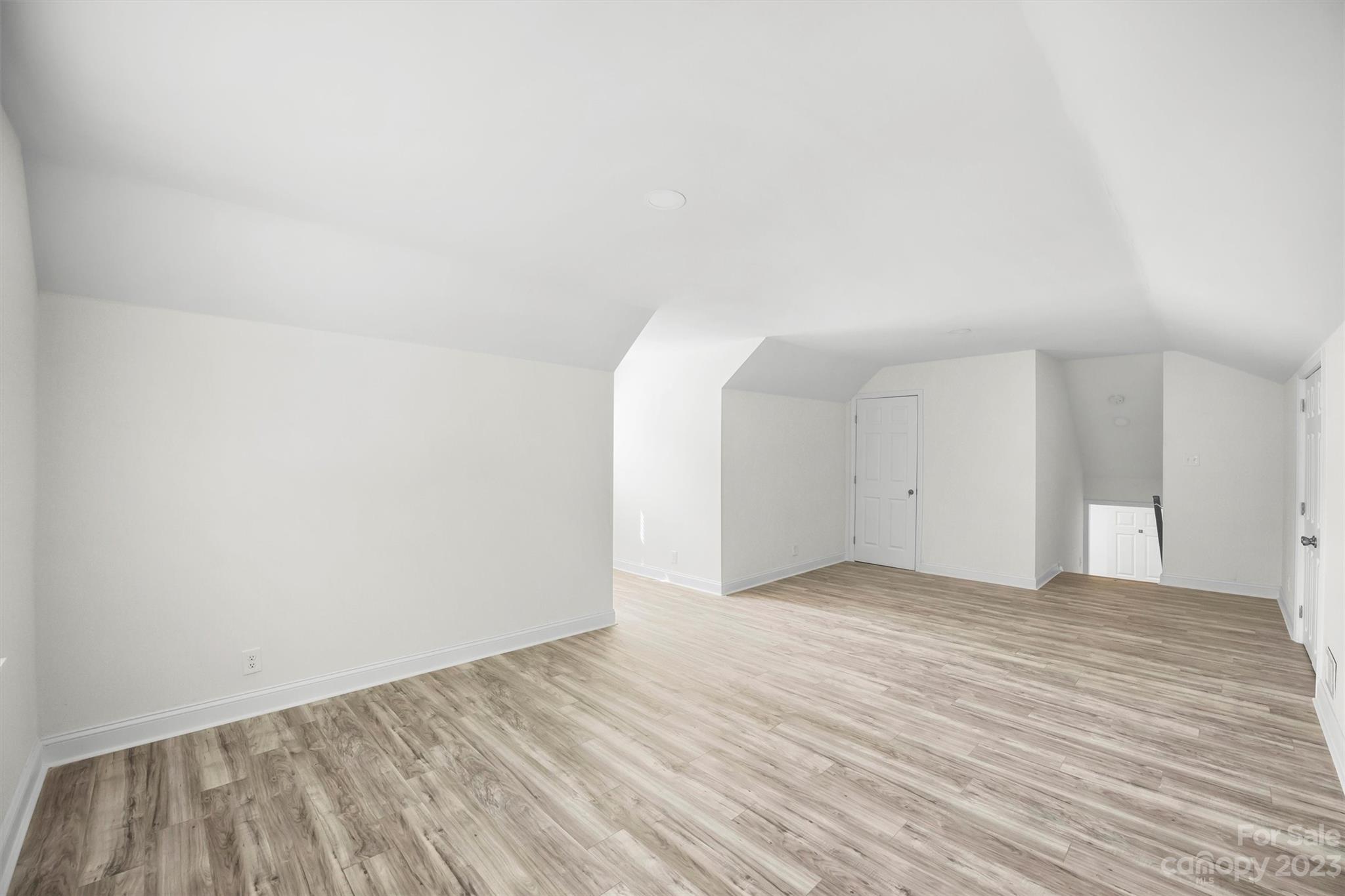 3900 Rhodes Avenue Charlotte, NC 28210 - Photo 16 of 23 a view of an empty room and wooden floor