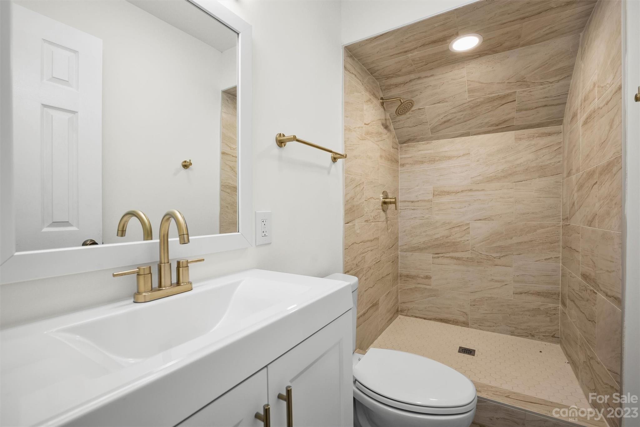 3900 Rhodes Avenue Charlotte, NC 28210 - Photo 18 of 23 a bathroom with a sink a toilet and shower