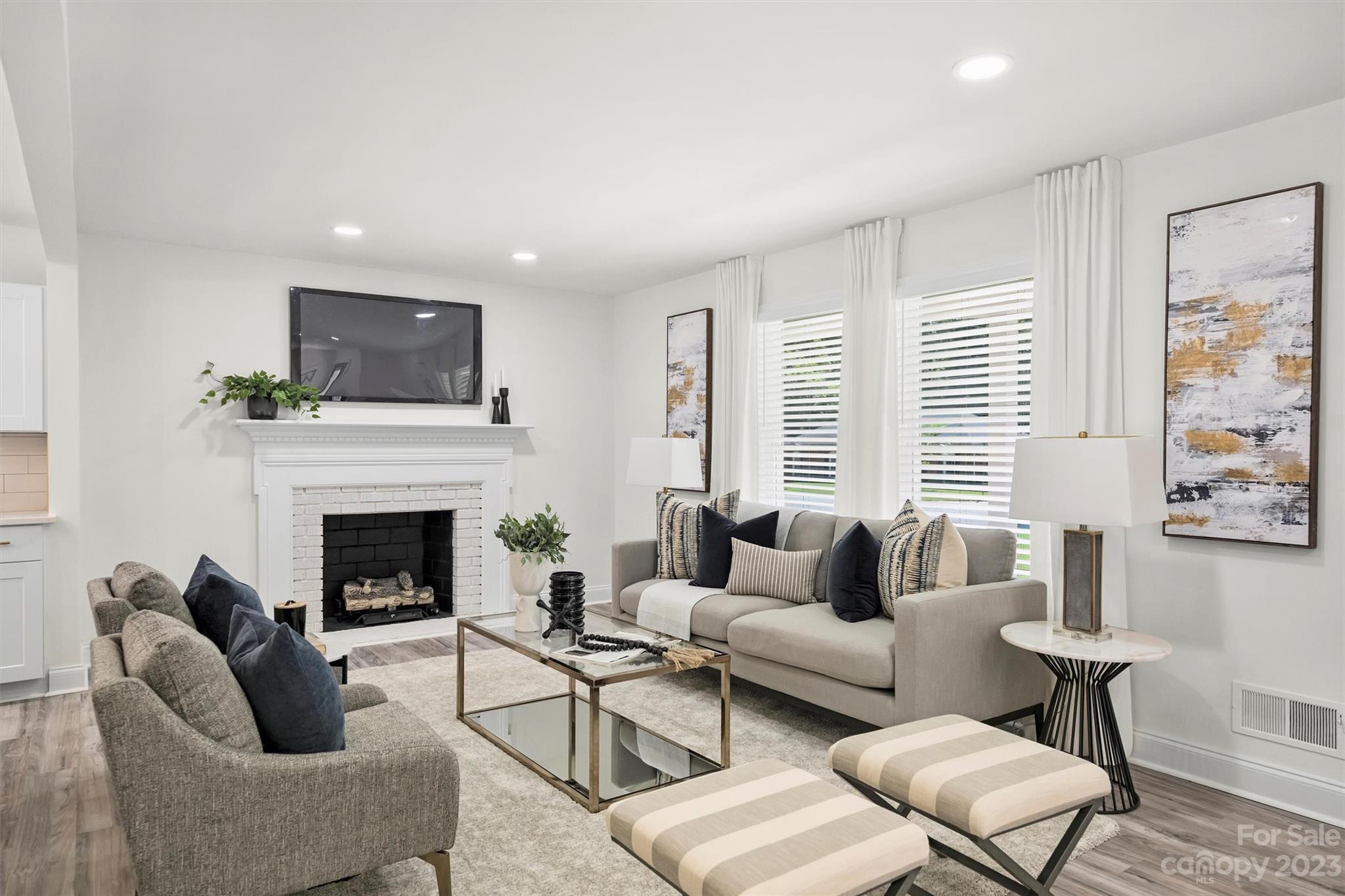 3900 Rhodes Avenue Charlotte, NC 28210 - Photo 2 of 23 a living room with furniture a fireplace and a flat screen tv