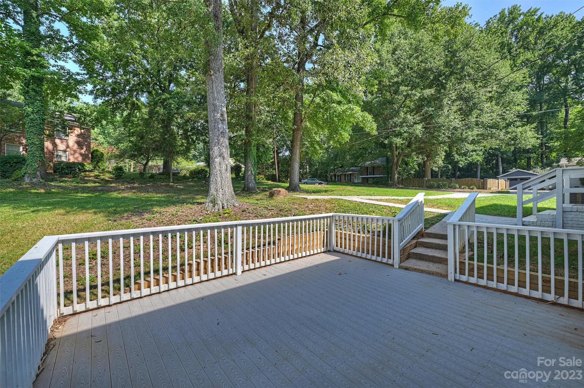 3900 Rhodes Avenue Charlotte, NC 28210 - Photo 21 of 23 a view of a roof deck with a small yard