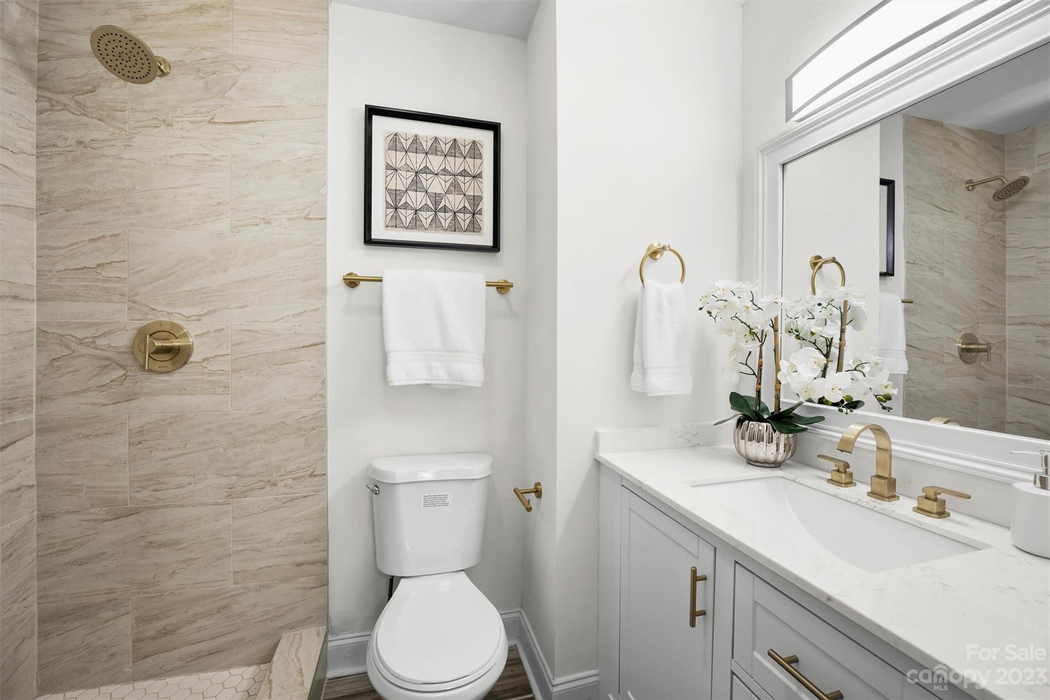 3900 Rhodes Avenue Charlotte, NC 28210 - Photo 10 of 23 a bathroom with a sink a toilet and shower