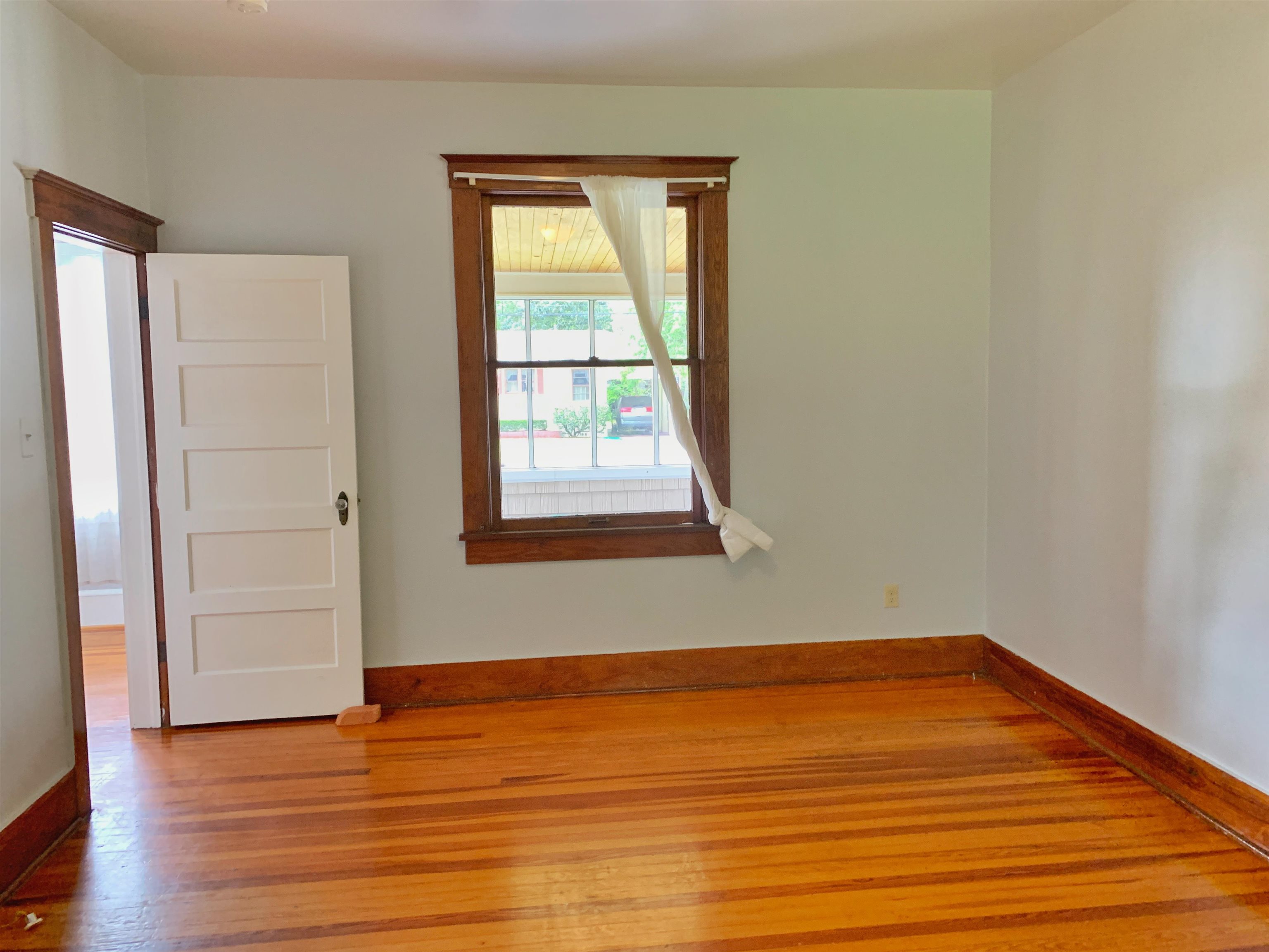 142 Oviedo Street St. Augustine, FL 32084 - Photo 12 of 15 an empty room with wooden floor and windows