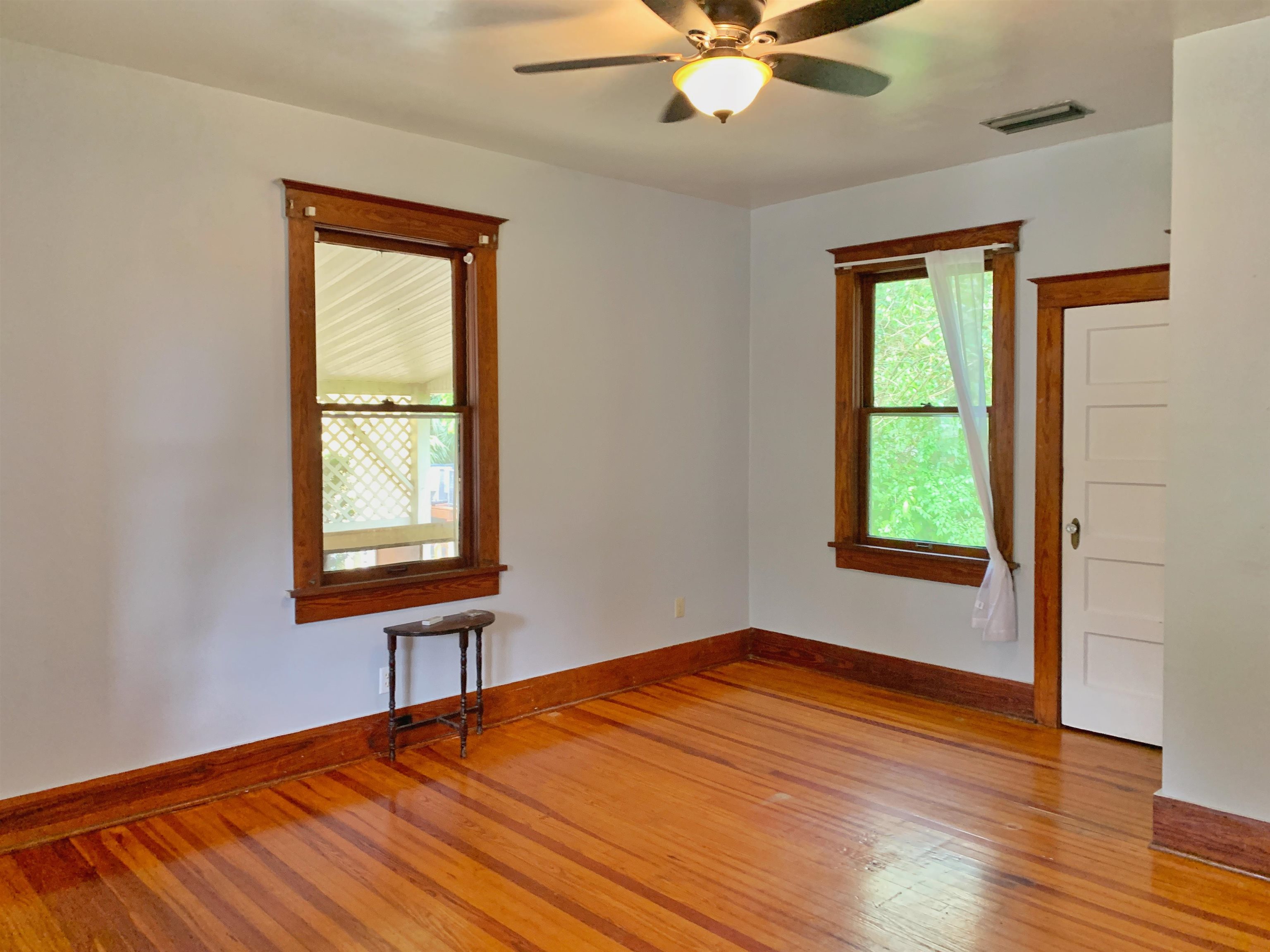 142 Oviedo Street St. Augustine, FL 32084 - Photo 13 of 15 a view of an empty room with a window and wooden floor