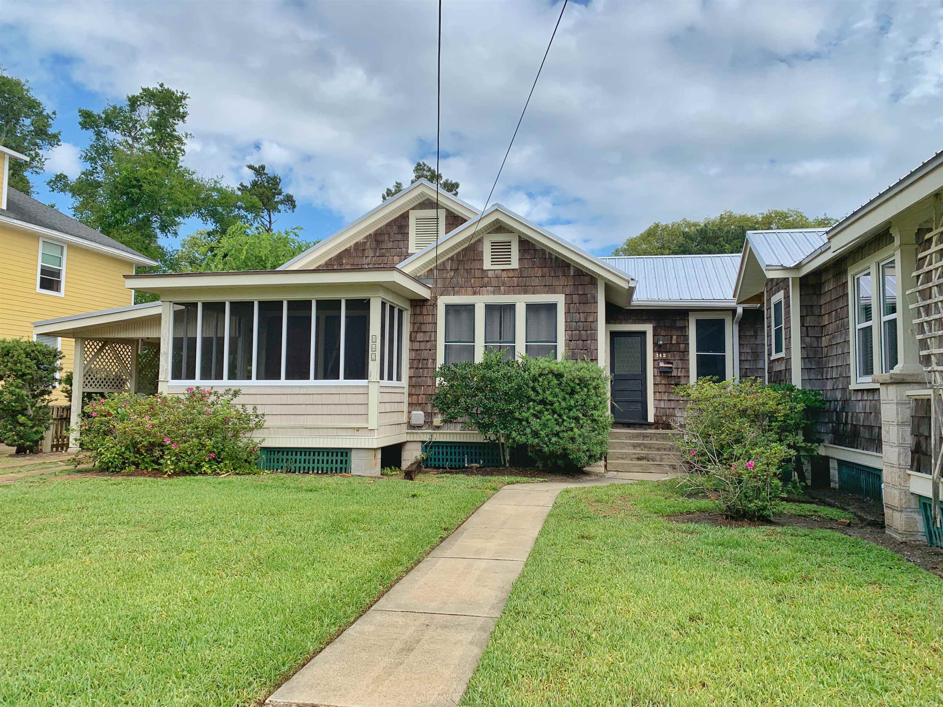 142 Oviedo Street St. Augustine, FL 32084 - Photo 15 of 15 a front view of a house with a yard