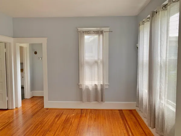 a view of wooden floor in an empty room