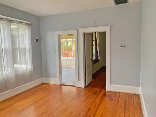 a view of wooden floor in an empty room