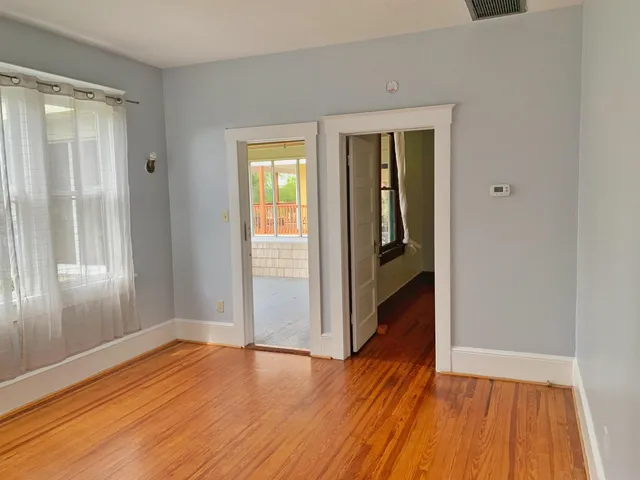a view of wooden floor in an empty room