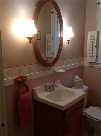 78 Richfield Road Arlington, MA 02474 - Photo 14 of 30 a bathroom with a sink a mirror and a toilet