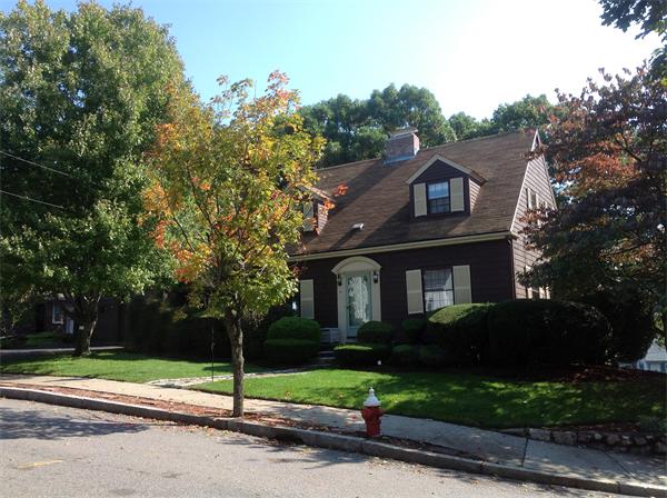 78 Richfield Road Arlington, MA 02474 - Photo 2 of 30 a front view of a house with a yard and garage