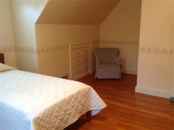 78 Richfield Road Arlington, MA 02474 - Photo 23 of 30 a bedroom with a bed and a chair