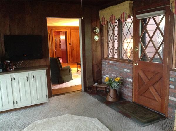 78 Richfield Road Arlington, MA 02474 - Photo 8 of 30 a hallway with two couches and a flat screen tv