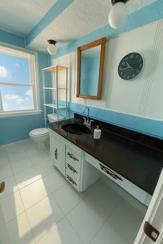 a bathroom with a sink and a mirror