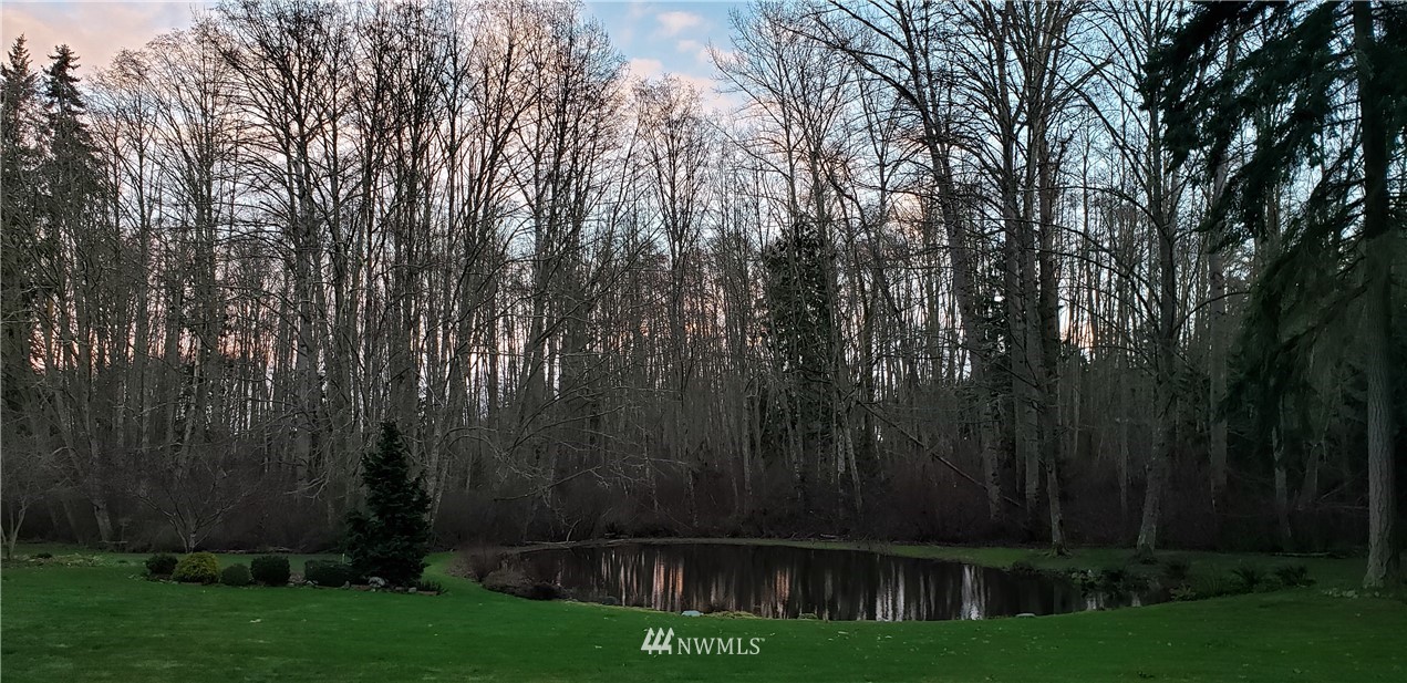 151 Kirk Road Sequim, WA 98382 - Photo 22 of 36 a view of garden with trees in the background