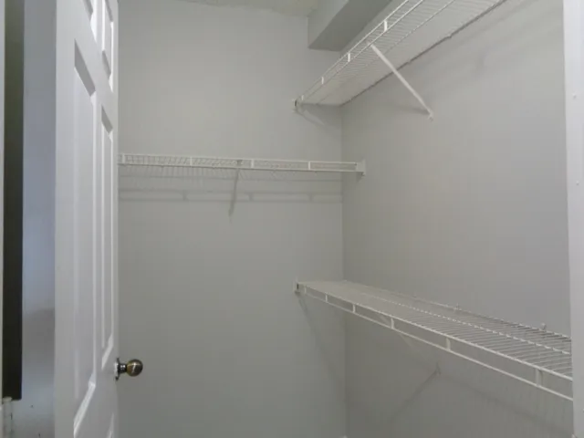 a view of a room with racks on the wall