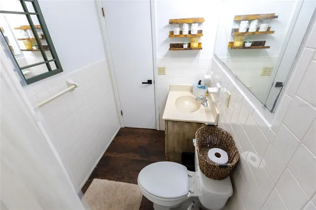 a bathroom with a toilet and a sink
