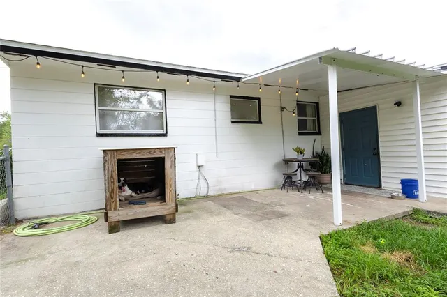 a view of a livingroom with a chair and fireplace