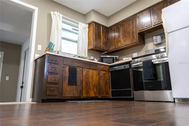 a view of an entryway with wooden floor