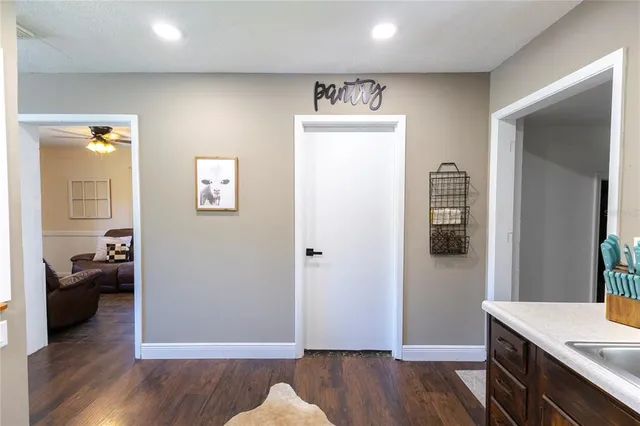 a view of a room with wooden floor cabinet and bedroom