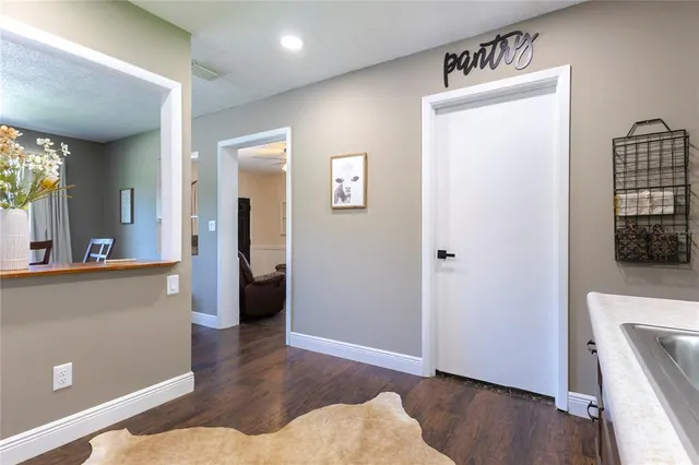 a view of livingroom with hardwood floor and hallway