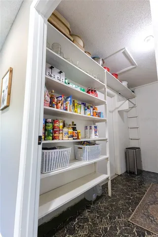 a cabinet with wine glasses in it