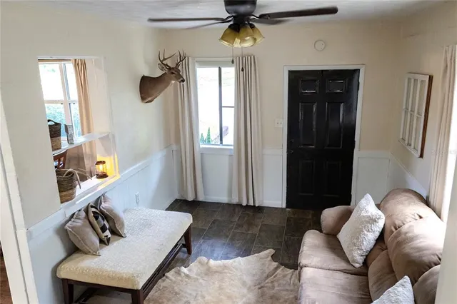 a living room with furniture and a window