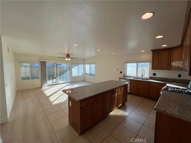 a large kitchen with granite countertop lots of counter top space