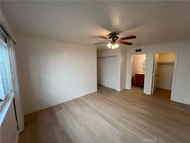 a bathroom with a sink mirror vanity and toilet