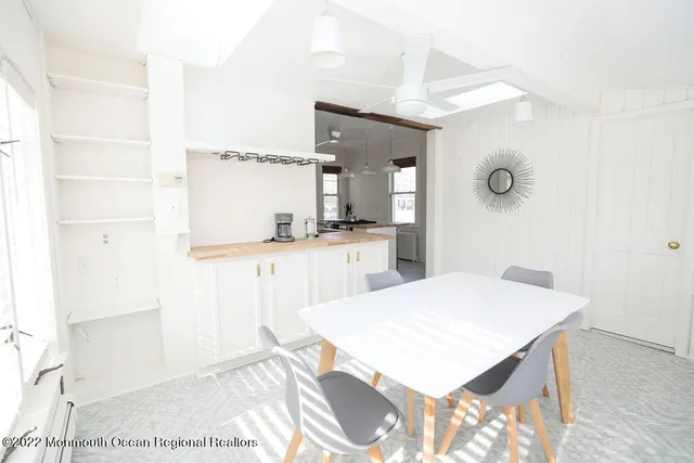 a kitchen with granite countertop a sink cabinets and stainless steel appliances