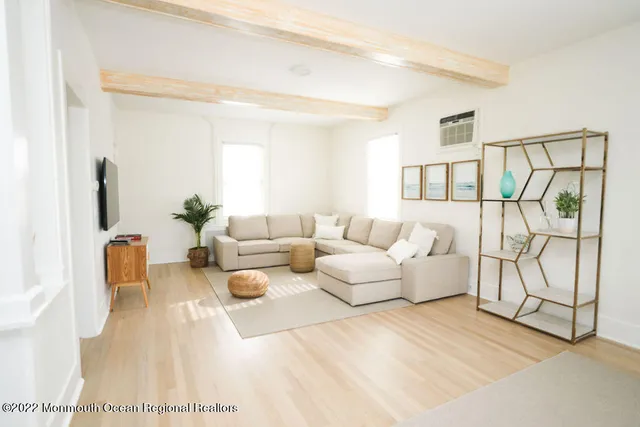 a living room with furniture and white walls