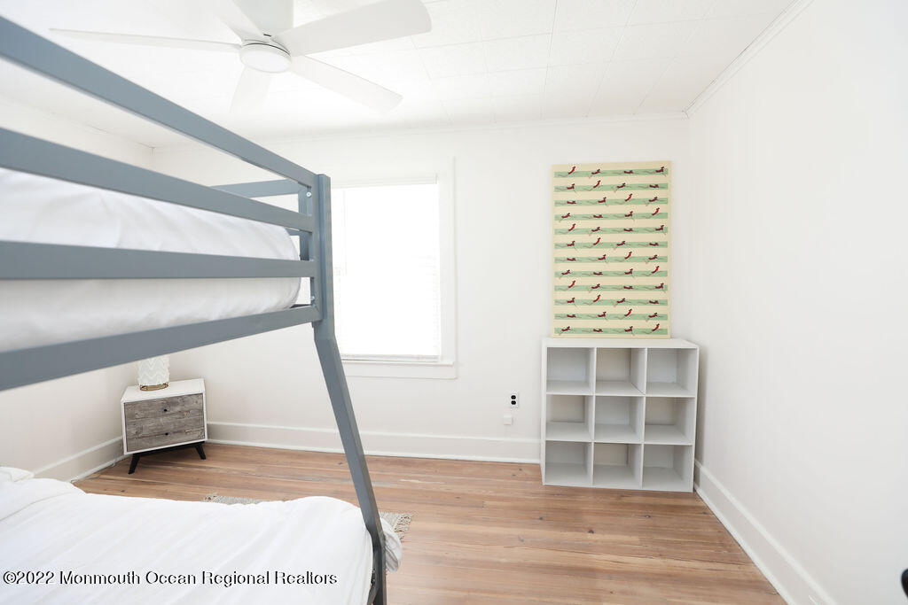 487 West Street Long Branch, NJ 07740 - Photo 29 of 48 a view of an empty room with wooden floor and a window
