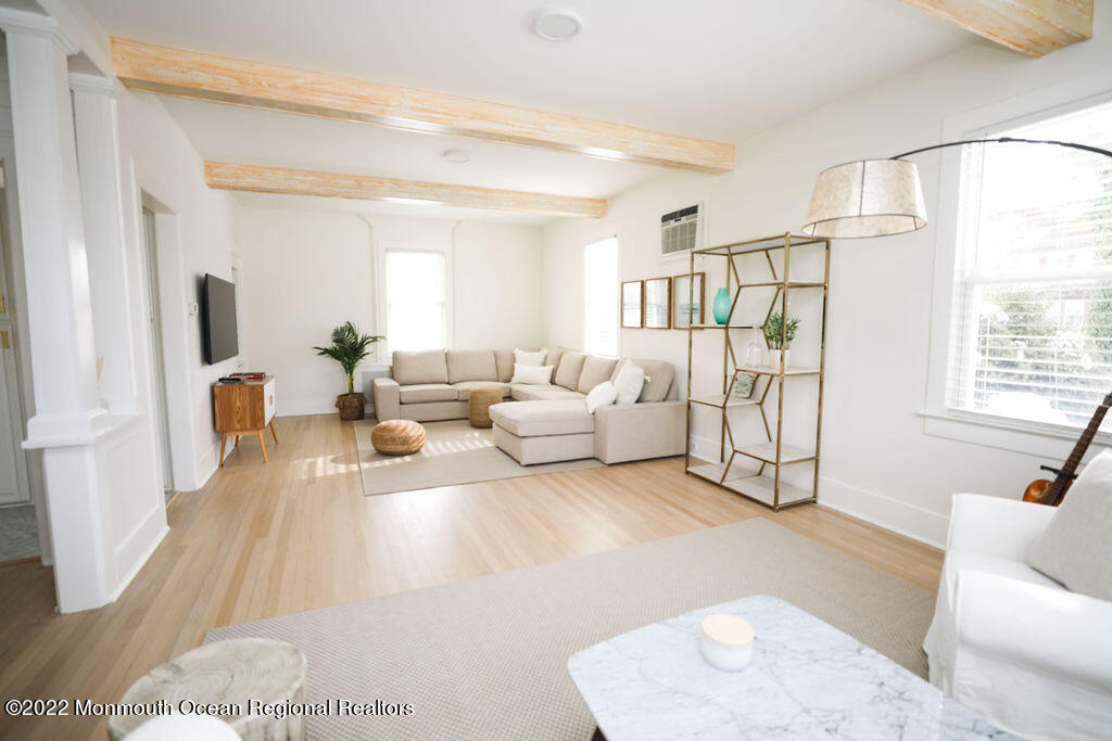 487 West Street Long Branch, NJ 07740 - Photo 3 of 48 a living room with furniture and a flat screen tv