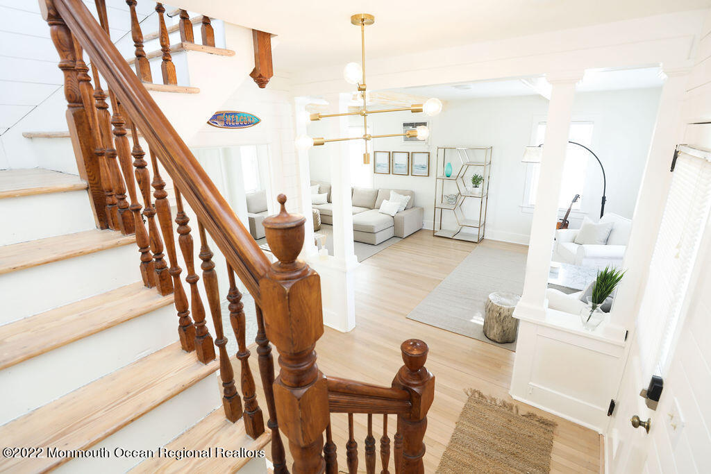 487 West Street Long Branch, NJ 07740 - Photo 35 of 48 a living room with furniture and a chandelier
