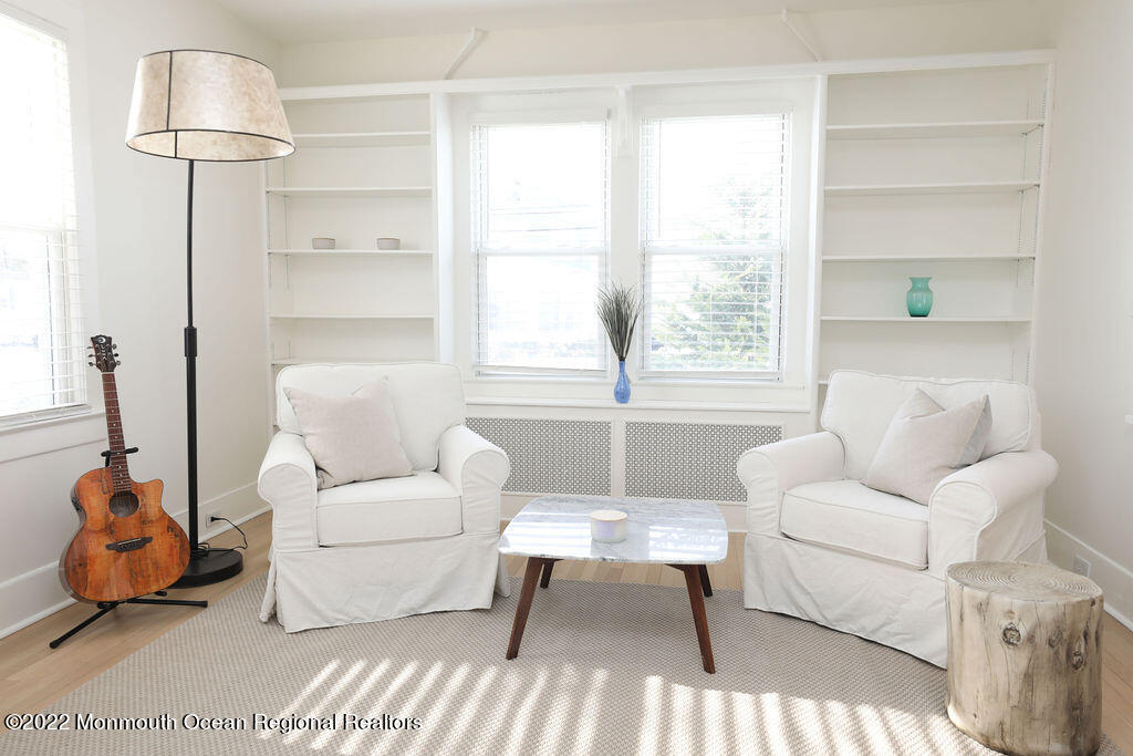 487 West Street Long Branch, NJ 07740 - Photo 41 of 48 a living room with furniture a table and a large window