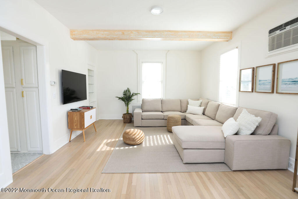 487 West Street Long Branch, NJ 07740 - Photo 7 of 48 a living room with furniture and a flat screen tv