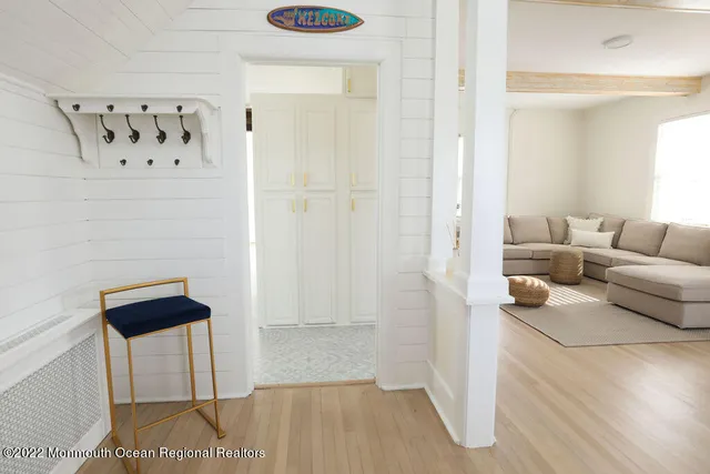 a living room with furniture and a rug