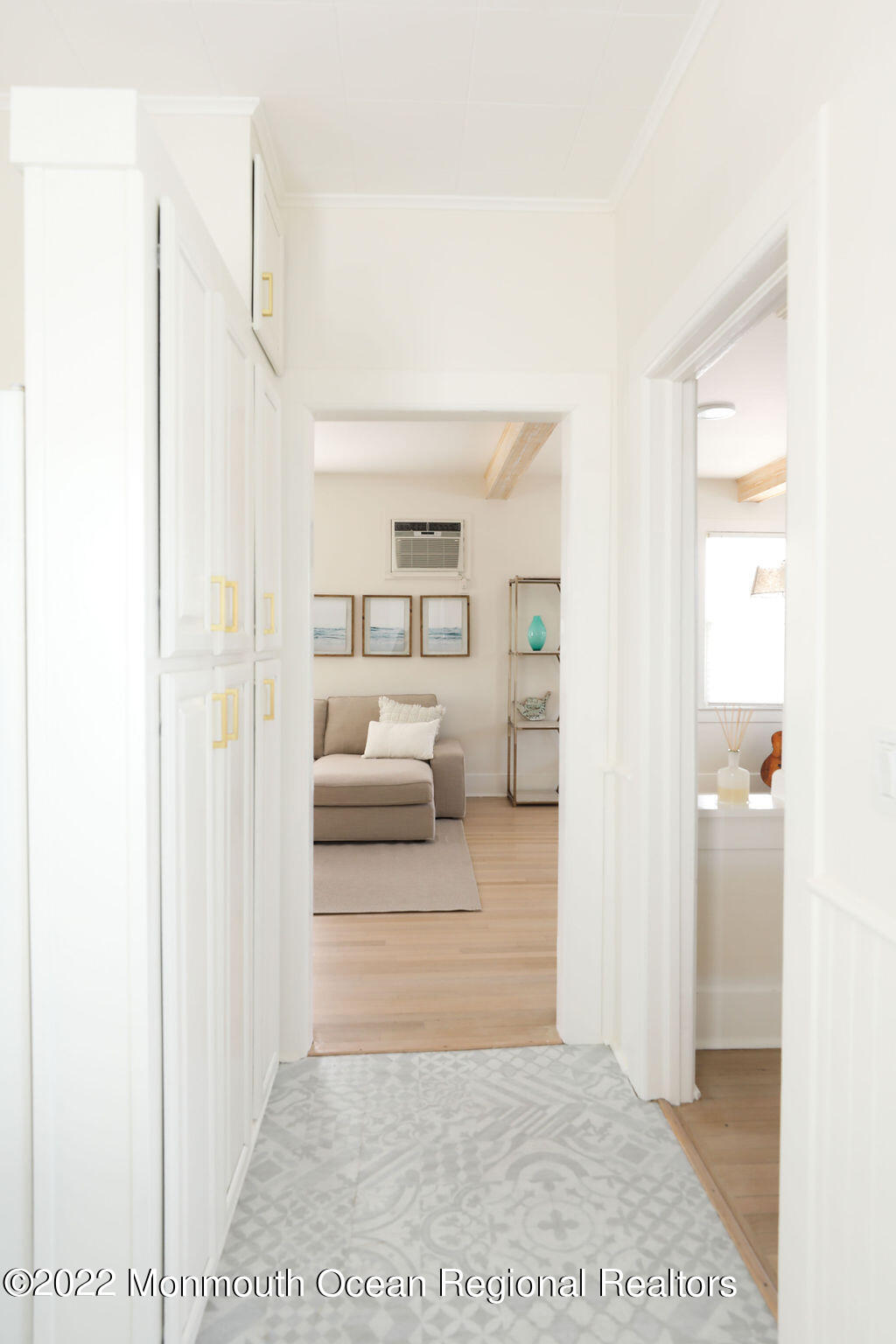 487 West Street Long Branch, NJ 07740 - Photo 10 of 48 a view of a bedroom with a white bed and a dresser