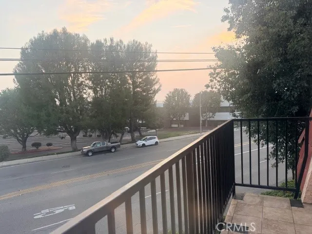 a view of a street from a balcony