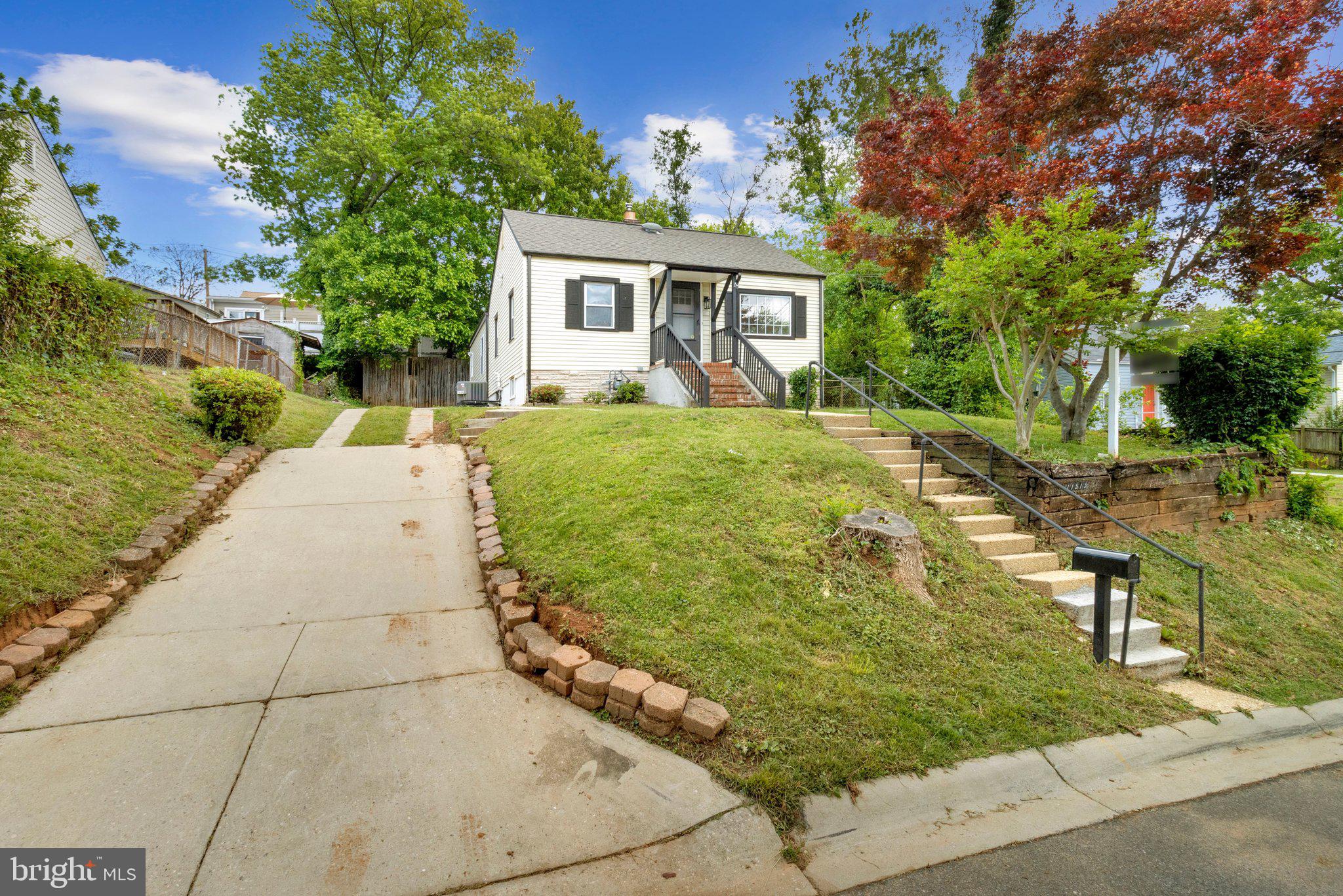 11515 Goodloe Road Silver Spring, MD 20906 - Photo 2 of 33 a front view of a house with garden