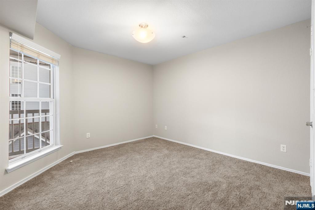 690 Rt 23, Unit R1 Wayne, NJ 07470 - Photo 6 of 11 an empty room with a window