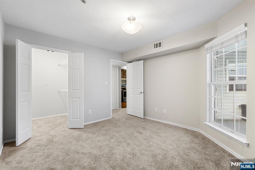 690 Rt 23, Unit R1 Wayne, NJ 07470 - Photo 7 of 11 a view of an empty room with a window