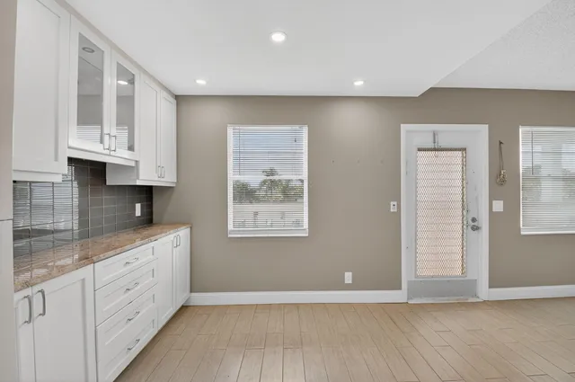 a view of kitchen with wooden floor