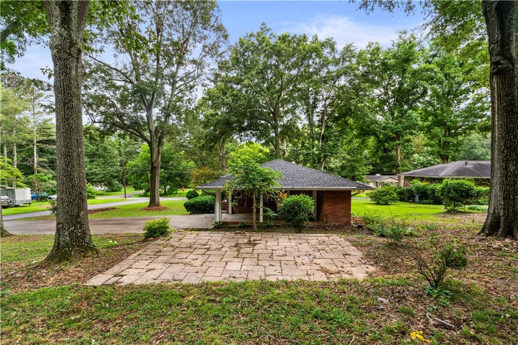 23 East Camelia Road Northeast Rome, GA 30161 - Photo 22 of 27 a front view of a house with garden