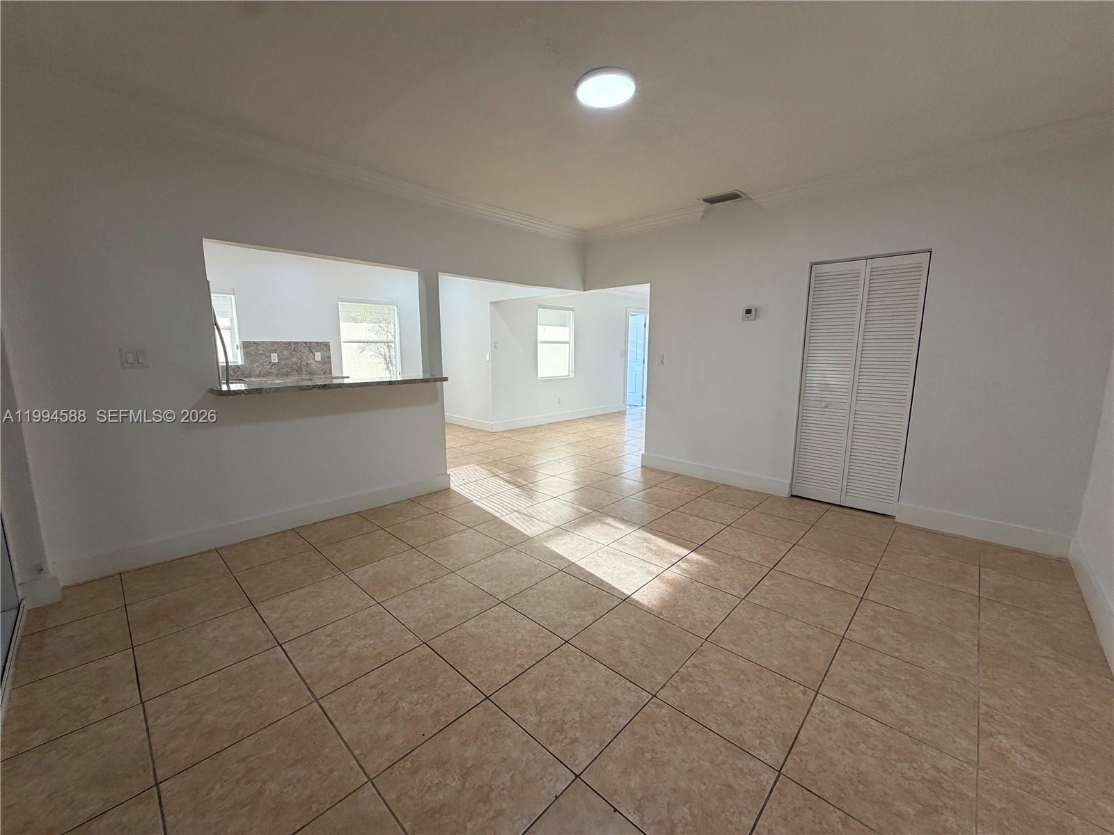 3373 Southwest 29th Terrace Miami, FL 33133 - Photo 22 of 26 an empty room with a empty space and windows