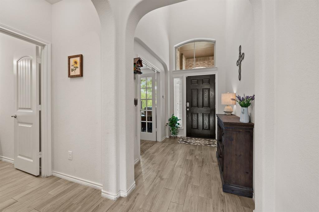 15817 White Mill Road Fort Worth, TX 76177 - Photo 3 of 27 a view of a livingroom with wooden floor and an entryway