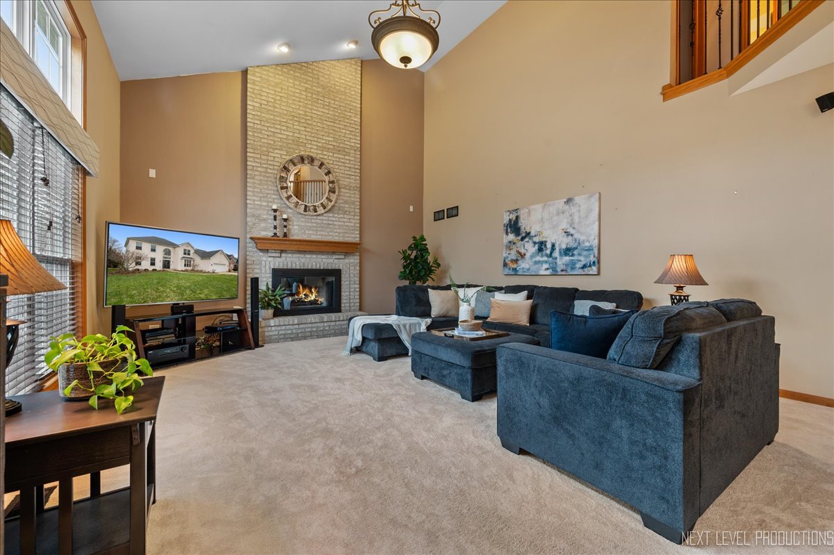 2620 Sweetbroom Road Naperville, IL 60564 - Photo 7 of 30 a living room with furniture and a fireplace