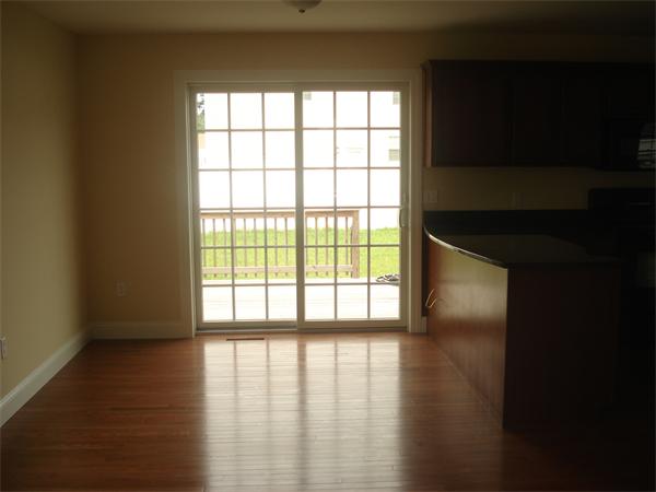 311 Arnold Springfield, MA 01119 - Photo 9 of 22 a view of empty room with wooden floor and fan