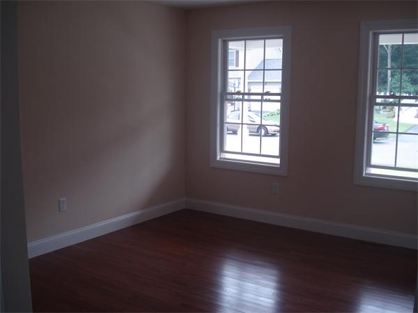 311 Arnold Springfield, MA 01119 - Photo 10 of 22 an empty room with wooden floor and windows