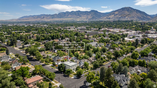 299 West Center Street, Unit 2 Logan, UT 84321 - Photo 39 of 46 Aerial perspective showcasing a community setting with extensive tree canopies and mountainous terrain