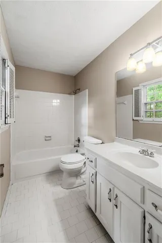 a bathroom with a sink a toilet and a bathtub